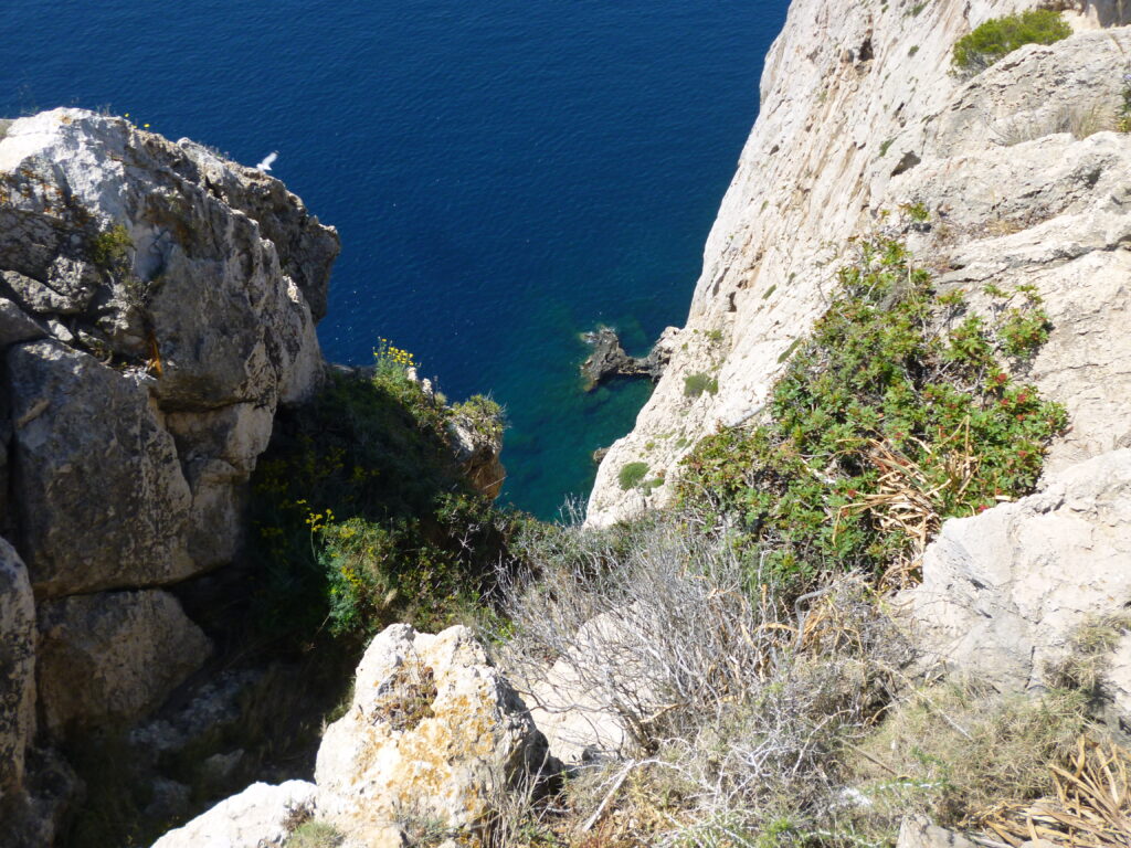 Cliff with blue sea, rocks